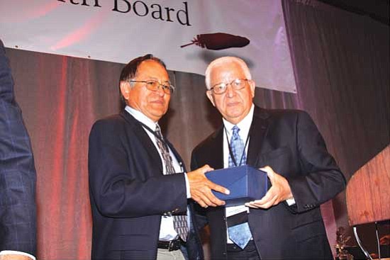 <i>Courtesy photo</i><br>
Anslem Roanhorse Jr. receives the National Impact Award from NIHB Vice Chairman Buford Rolin.