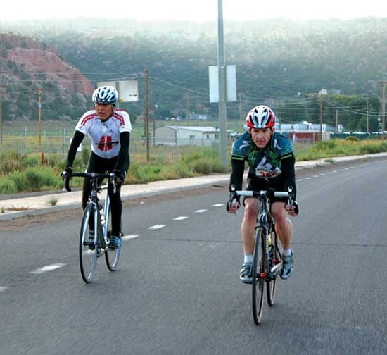 <i>Courtesy photo</i><br>
A pair of cyclists ride through Tse Bonito, N.M. during the Fourth Annual Navajo Nation Fair Bike Ride on Sept. 10. Approximately 40 riders in the advanced riders division took to the road before dawn from the Window Rock Veterans Memorial Park.