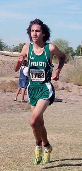 <i>Photo by Carl Perry</i><br>
Tuba City junior Billy Orman on his way to a record breaking victory at the Arizona State Cross Country Championships.