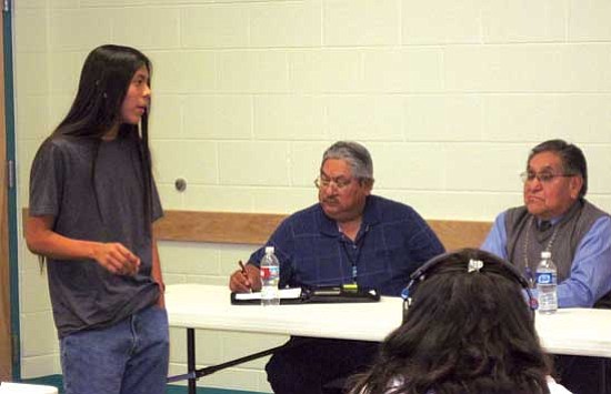 <i>Rosanda Suetopka Thayer</i><br>
Kykotsmovi student and one of the signers of Hopi community petition protesting an extension be granted to Peabody Coal is Kyle Nutumya who gave public testimony regarding the Peabody LOM request. Seated (from left) are Clayton Honyumptewa (center), Director of Hopi Lands and Hopi Chairman LeRoy Shingoitewa.
