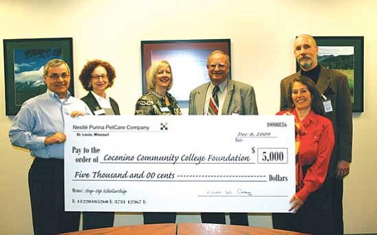 <i>Courtesy photo</i><br>
Nestle Purina Petcare Plant Manager, Bill Calloway (far left) presents Coconino Community College and Juvenile Court representatives with a $5,000 check for the CCC Foundation's Step Up Endowed Scholarship. From left: Calloway; Kathi Zahl,CCC Foundation Coordinator; CCC President Leah L. Bornstein, CCC Foundation Director Robert Erb; Prevention Coordinator Diedra Sibert; and CCC Foundation Board President Chris Bavasi.