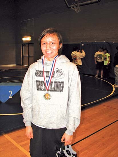 <i>Courtesy photo</i><br>
Four-time Arizona Girls State Wrestling Champion Francita Bitah of Greyhills Academy High School poses with her championship medal.