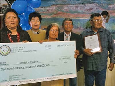 <i>Courtesy photo</i><br>
From left to right: Cornfields Chapter officials Marilyn T. Begay, Office Specialist; Linda J. Youvella, Secretary/Treasurer; Elizabeth B. Johnson, Community Services Coordinator; Justin Johnson, Vice President; and Jimmy Taliman Sr., President, stand with a check for $160,000 to help start local development.