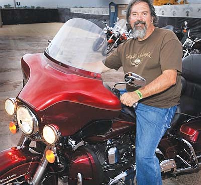 <i>Todd Roth/NHO</i><br>
Rally host Tom McCauley, parking his Harley-Davidson motorcycle.