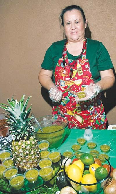 <i>Todd Roth/NHO</i><br>
Henriettia Baca prepares her delicious fruit salsa during the Winslow Salsa Festival held Oct. 16.