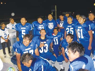 <i>Stan Bindell/NHO</i><br>
The Hopi High football team celebrates their 13-8 homecoming victory over Greyhills Academy.