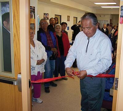 <i>Courtesy photo</i><br>
Navajo Nation Supreme Court Chief Justice Herb Yazzie cuts the ribbon to the To’hajiilee District Court room. The courtroom was dedicated to the To’hajiilee community Nov. 18 during a dedication ceremony.