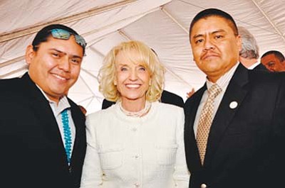 <i>Photo courtesy of Mark Butler</i><br>
From left to right: Eric Descheenie, legislative staff assistant from the Navajo Office of the Speaker; Gov. Jan Brewer; and Council Delegate-elect Jonathan Hale at Gov. Brewer’s 2011 State of Arizona Inauguration Ceremony.