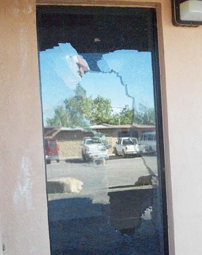 Tyler Tawahongva/NHO<br>
Broken glass is left behind after vandals damaged the building.
