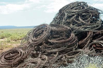 Submitted photo<br>
A pile of barbed wire sits along one of the ranches awaiting use.