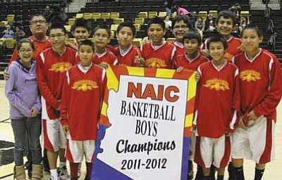 Submitted Photo<br>
Pictured from left are Lottie Saufkie (Manager), Coach Terry Billy, Devaughn Sheperd, Kaleb Sandoval, Cordell Granger, Davean Yazzie, Chance Begay, Shannon Riggs, Orrin Black, Albert Fuller, Roland Becenti, Isaiah Begay, and Jamal Yazzie.