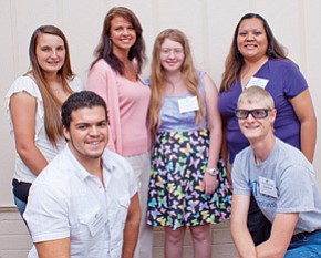 Outstanding Northland Pioneer College graduates include (kneeling) Eduardo Diaz and Cody Elliott and standing, from left are Carrie Faulkner, Barbara Akins, Tanya Puckett and Cassandra Nahsonhoya. <i>Submitted photo</i>