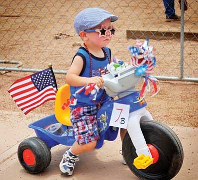 Landen Johnson takes the Fourth of July Freedom Festival Winslow event with the seriousness of Thomas Jefferson.