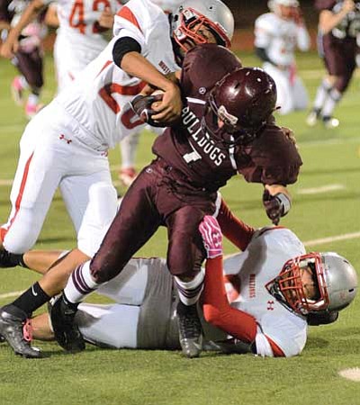 Henry Montiel drives for a first down during the Bulldog’s 62-28 win against Monument Valley Oct. 19.  Photo/Todd Roth