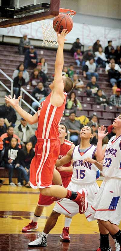 A Durang Demon drives hard to the hoop during the team’s 38-33 championship victory over Holbrook in the Tate’s Shootout Tourney Dec. 1 in Winslow. Photo/Todd Roth