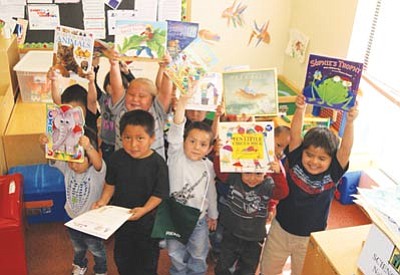 Children at a Navajo Head Start enjoy new books the Navajo Library donated April 16. Submitted photos