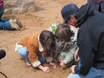 Children learn planting techniques at last year’s Planting Day at the Hopi Cultural Center on Second Mesa, Ariz.
