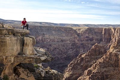 Nik Wallenda looks at the area over the Little Colorado River in the Grand Canyon. Wallenda will tightrope walk over the canyon June 23. Photo/Jason Elias/Discovery Channel.