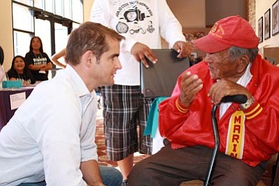 Assistant Secretary for Veterans Affairs Tommy Sowers talks with Navajo Code Talker Dan Akee at the June 19-20 Southwest Region Veterans Summit. Photo/Monica Cabrera
