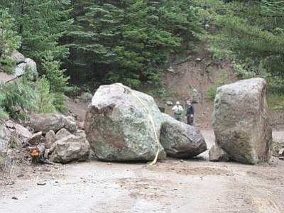 A boulder sits on Elden Lookout Road after it crushed a man Sept. 10. Submitted photo