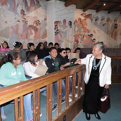 Katherine Benally, chair of the Navajo Nation Resources and Development Committee and council delegate greets Tuba City Junior High language immersion students on their visit to the Navajo capital Oct. 23. Photo/Rosanda Suetopka Thayer