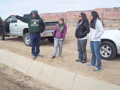 Frank Begay shows Johns Hopkins Center for American Indian Health (CAIH) Feast for the Future program staff an irrigation ditch that needs to be cleaned. Submitted photo