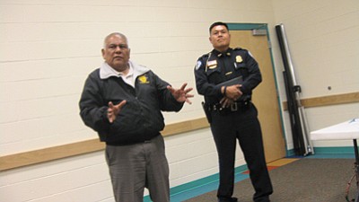 Former Hopi Chairman Ivan Sidney and Bureau of Indian Affairs Hopi Police Chief Jamie Kootswatewa discuss law enforcement issues during a March 11 Department of Justice listening session in Kykotsmovi, Ariz. Photo/Tyler Tawahongva