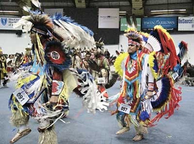 Dancers perform during one of the Grand Entries at the 2014 Powwow at the Walkup Skydome on the campus of Northern Arizona University April 12-13. Loretta Yerian/NHO