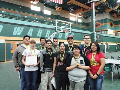 Front row from left:  Brianna Loughran, Alexander Nez, Robyn Haskey, Micah Bahe and Titiana Nez. Back row from left:  Allen Joe, Wesley Loughran, Isaac Manrique, Tyler Johnson and Joseph Justice. These Tuba City High School graduating seniors have the highest final grade point averages at the school. Each has earned a full scholarship to varied universities. Rosanda Suetopka/NHO