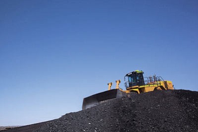A bulldozer crawls over a pile of coal at Peabody’s Kayenta mine on the Navajo Nation in this 2012 photo. Photo/Peabody Energy