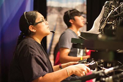 Hopi High video students Tierra Lomabalaquihoya and Star Not Afraid learned to work TV cameras at Northern Arizona University.  Photo/Kursheena Yazzie
