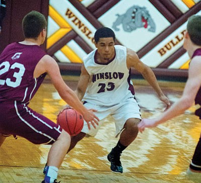 The Winslow Bulldogs lost to the Snowflake Lobos 79-58 Feb. 20 in the Arizona State Division III Tournament, ending the Bulldogs’ season. Photo/Todd Roth
