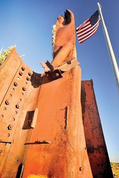 A detail of a piece of the Twin Towers on permanent display at the east End 9-11 Memorial Park. The memorial is a joint effort of Winslow Rotary and the city of Winslow.  Photo/Todd Roth