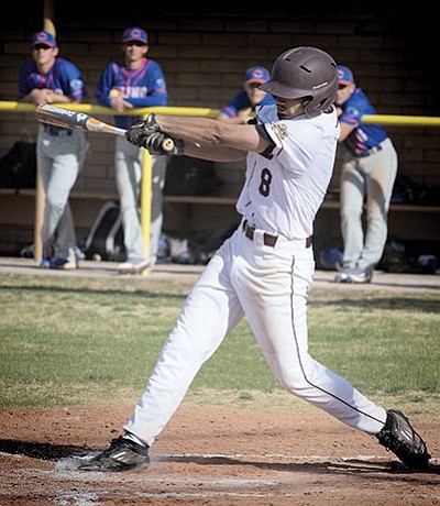 Winslow Bulldog Matt Bollin takes a mighty cut at the plate. Todd Roth/NHO