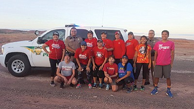 A group of Tuba City community members participated in a memorial run May 4 in Tuba City in remembrance of Ashlynn Mike who was abducted and killed in New Mexico. Backrow from left: Nakia Eryn, Officer Ernie Gishie, Sarah Thompson, Melissa Begody, Patrice Dele, Claudia Littleman, unknown, Officer Donald Seimy and Taylor Begody. Front row from left: Leon Manygoats, Kristy Nez, Crystal Begody, Unknown, Caroline Dann Betoney and Chemarin Tsinnie. Submitted photo