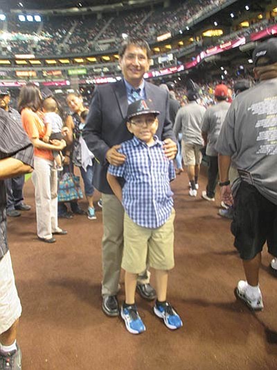 Navajo Nation Vice President Jonathan Nez with his son at Arizona Diamondbacks Native American Recognition Day June 11. Stan Bindell/NHO