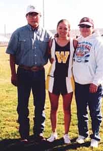 Stan Bindell/Hopi Jr/Sr High School
Winslow’s Janeen Yazzie celebrates 3A North girls’ regional first place with parents Brenda and Al.
