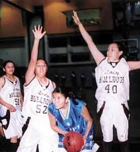 Stan Bindell/Observer
HopiÕs Candace Pocheoma goes up against many Winslow defenders.