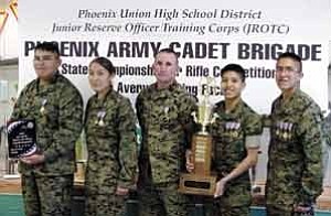 Rosanda Suetopka Thayer/TC District Media
Tuba City High School Warriors took the Arizona State Championship for Marksmanship and achieved number one ranking in the First Round of National Junior ROTC Sharp shooting. Pictured are Garrett Begay, left, 10th grade, Navajo Nation, First Place Gold Medal; Ashley Manygoats, 10th grade, Navajo Nation, First Place Gold Medal, Second Place Standing Position Silver Medal; Gunnery Sgt. Tim J. Shaner, 12th Grade First Place Coaches Gold Medal; Darrin Talawepi,11th grade, Hopi Tribe, First Place Gold Medal, Third Place Overall Individual Bronze Medal, Third Place Standing Position Bronze Medal; and Charles Lee,11th grade, Navajo Nation, First Place Gold Medal, Second Place Overall Individual Silver Medal, First Place Prone Position Gold Medal, First Place Standing Position Gold Medal.