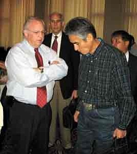 Photo by George Hardeen
BIA Director Jim Cason and Navajo President Joe Shirley Jr. share a few private thoughts following the first morning session of the BIA National Budget Meeting in Washington, D.C. Behind them is Office of Special Trustee head Ross Swimmer and  Navajo Division of Community Development Director Arbin Mitchell.