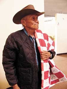 S.J. Wilson/Observer
Harold Wagoner proudly wears the quilt awarded to him for the effort he makes to participate in the Senior Citizen program at Birdsprings. Wagoner makes the journey on foot most days.