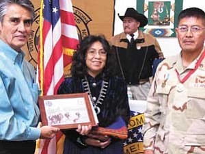 S.J. Wilson/Observer
Navajo Nation President Joe Shirley Jr., left, and First Lady Vikki Shirley present Staff Sgt. Lorenzo Lee with a plaque from the Navajo Nation. Lee also received the Warriors Medal of Valor, the Navajo Nation flag and other awards.