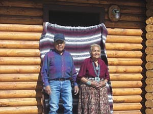 Photo by Hazel James
Navajo Elders Stephen and Rose Smith Smiths in front of their new their new Hooghan home in Sawmill with  a modern kitchen and appliances, a bathroom with handicapped accessories, a utility room and one bedroom.

