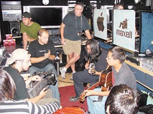 John Lennon Educational Tour Bus engineersÊwork with seven Tuba City High School music students who are participating in the NativeÊAmerican Composers Apprenticeship Program (NACAP) a program sponsored by the Grand Canyon Music Festival.Ê
