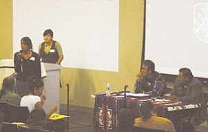 Photo/ Rebecca Schubert

Wahlea Jones (left) addresses Navajo Nation President Joe Shirley Jr. (right) and vice presidential candidate Ben Shelly (far right) at the Rock the Navajo Vote Forum held Oct. 23 at Northern Arizona University. Event organizer Kimberly Smith stands behind the podium

