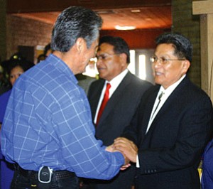 Navajo Nation President Joe Shirley Jr. (left) congratulates newly inagurated Hopi Tribal Chairman Ben Nuvamsa during inauguration ceremonies held March 21. The Hopi Tribal Council removed Nuvamsa from office a week later on March 28 after nullifying results from both the primary and general elections held earlier this year (Photo by Rebecca Schubert/Observer).