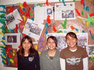 Pictured from left to right are: Trina Blackhat, Tylar Bia and Natalie Franklin. These students created a special bulletin board covering both on and off reservation news events (Photo by Rosanda Suetopka Thayer).
