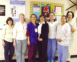 Representatives from the TCRHCC OB unit (from left): Dr. Amanda Leib, chief of OB-GYN; Barbara Orcutt, CNM, MSN, director of nurse midwives; Rachel Bonvillaine, RN; Shelly Inda, Obstetrical Unit lead clinical nurse; Patricia Hines, CNM; Alberta Nez, RN; and Lisa Hooper, RN (Photo courtesy of TCRHCC).