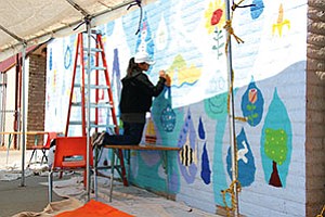 Fifth graders at the Eagles’ Nest Intermediate School at Tuba City District worked in summer school shifts to complete the second of a three-mural series that is being supervised by artist Larisa Aukon funded by an art grant from the Coconino County Arts Initiative and TCUSD’s own investment monies (Photo by Byron Poocha/TCUSD).