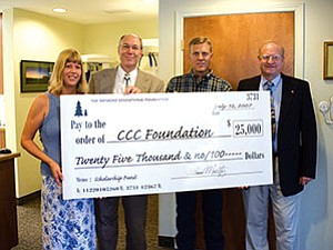 CCC Assistant Director for Student Financial Assistance Lisa Hill, Raymond Educational Foundation President Dr. Tom Montfort, Raymond Educational Foundation Board of Directors member Bill Cordasco and CCC Foundation Director Robert Erb display a check (Courtesy photo).
